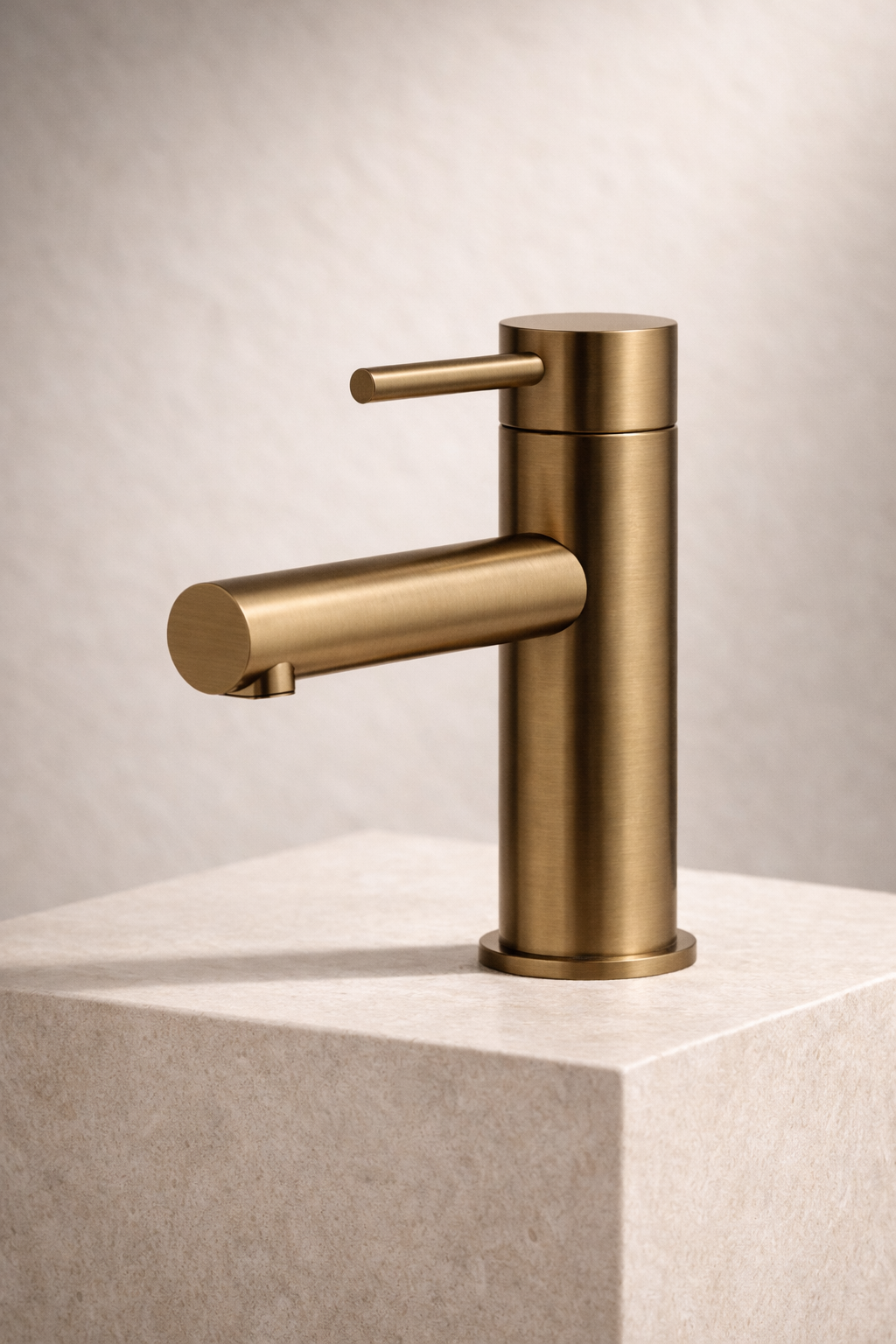 Antique Brass faucet on a beige stone surface with a neutral background