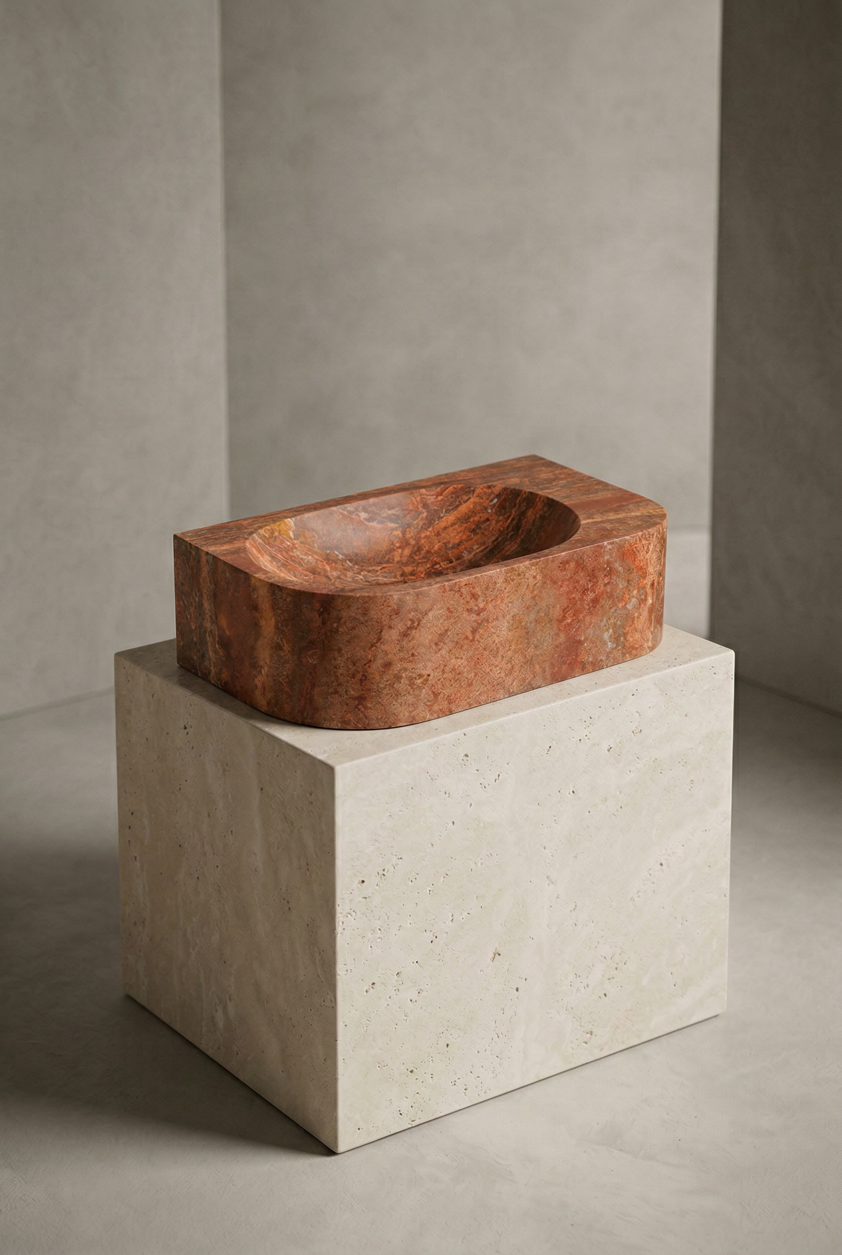 Red Stone Basin Sitting On Plinth