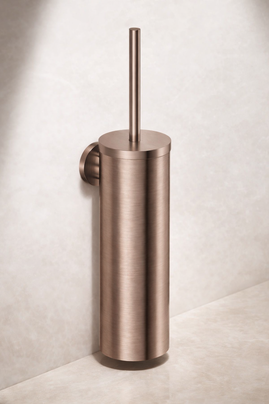 Stainless steel toilet brush holder mounted on a wall.