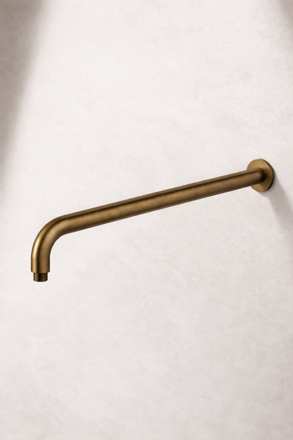 Antique Brass wall arm on a white background