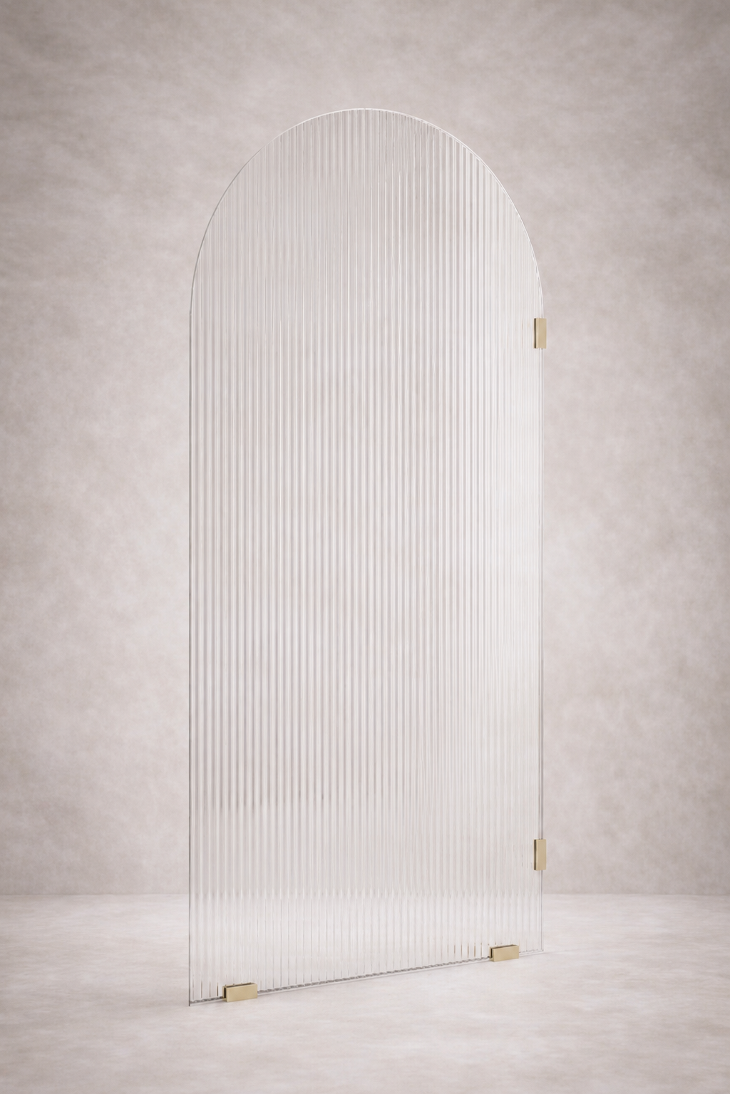Arched glass shower screen door with gold frames on a light grey background