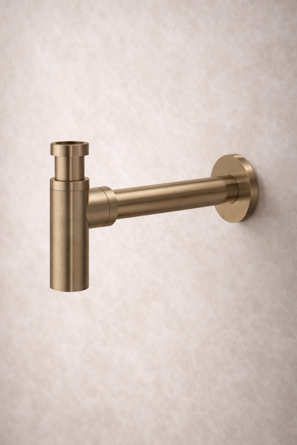 Antique Brass wall-mounted bottle trap on a beige background