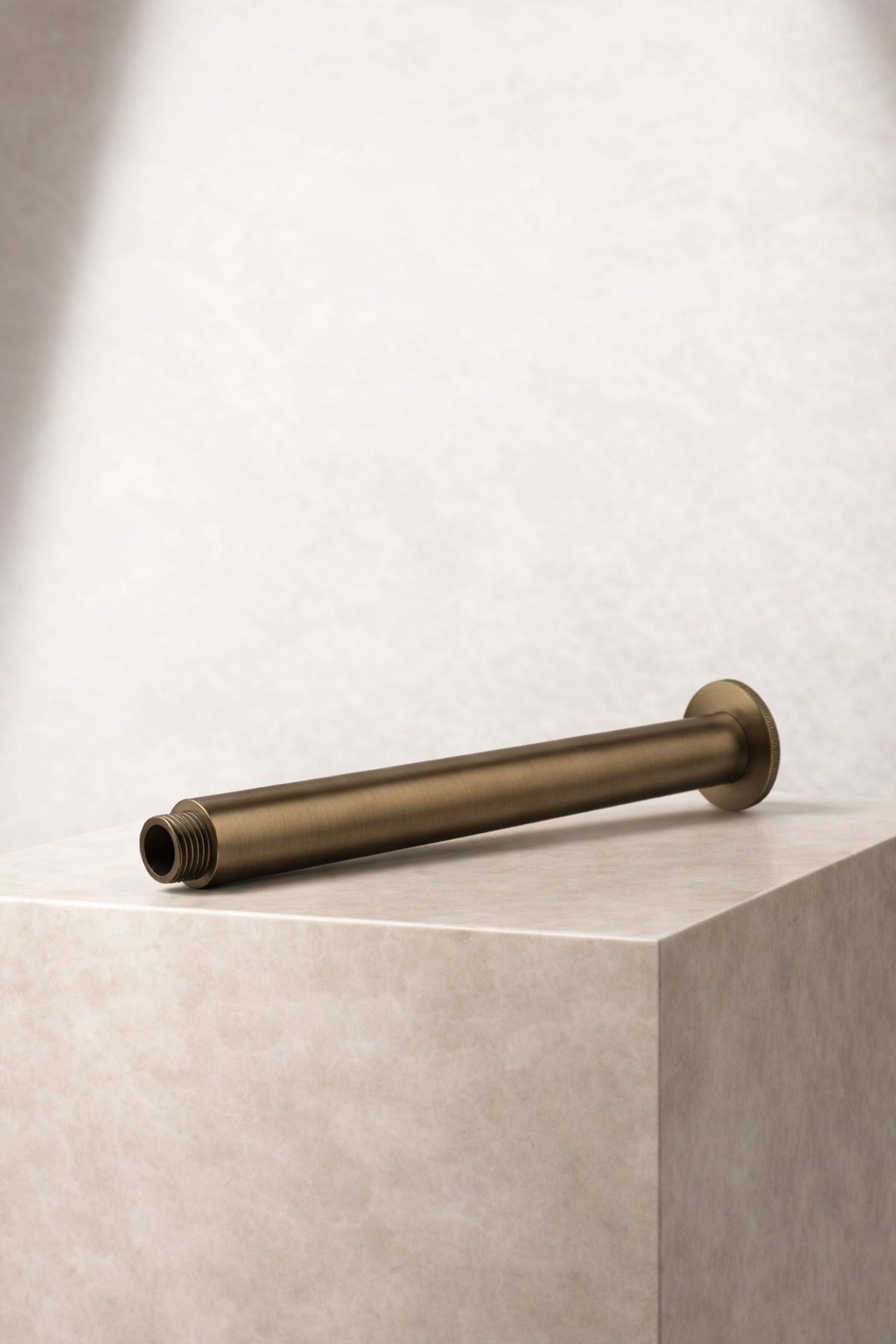 Antique Brass Ceiling Arm on a light beige surface with a neutral background