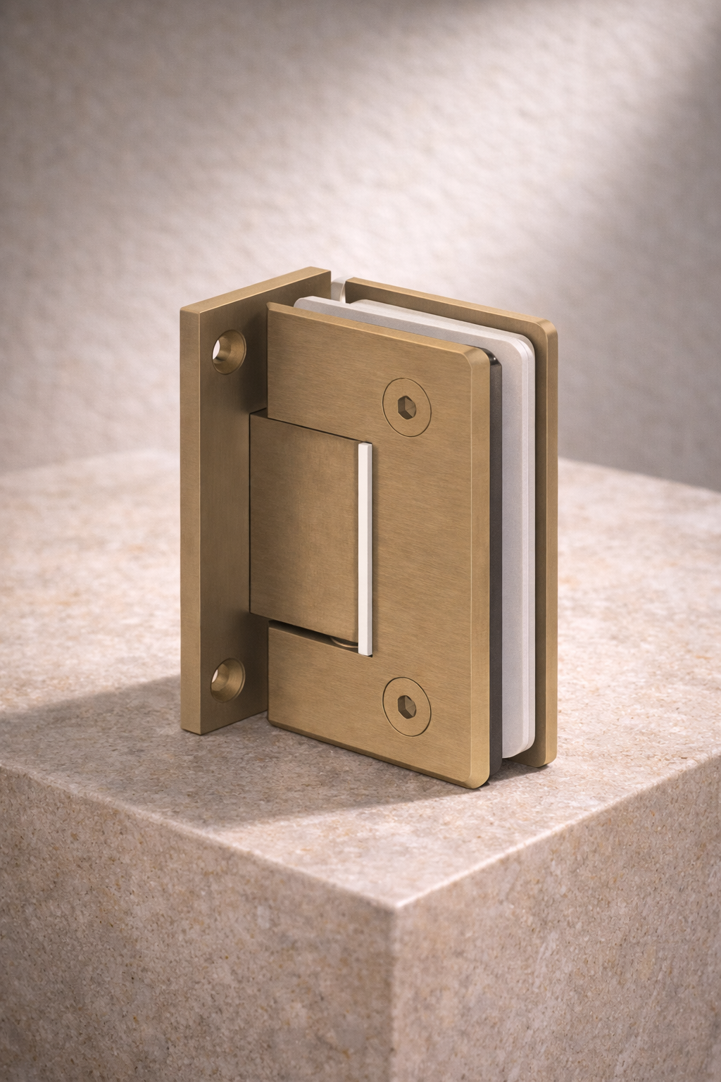 Brass shower hinge on a stone surface with a neutral background