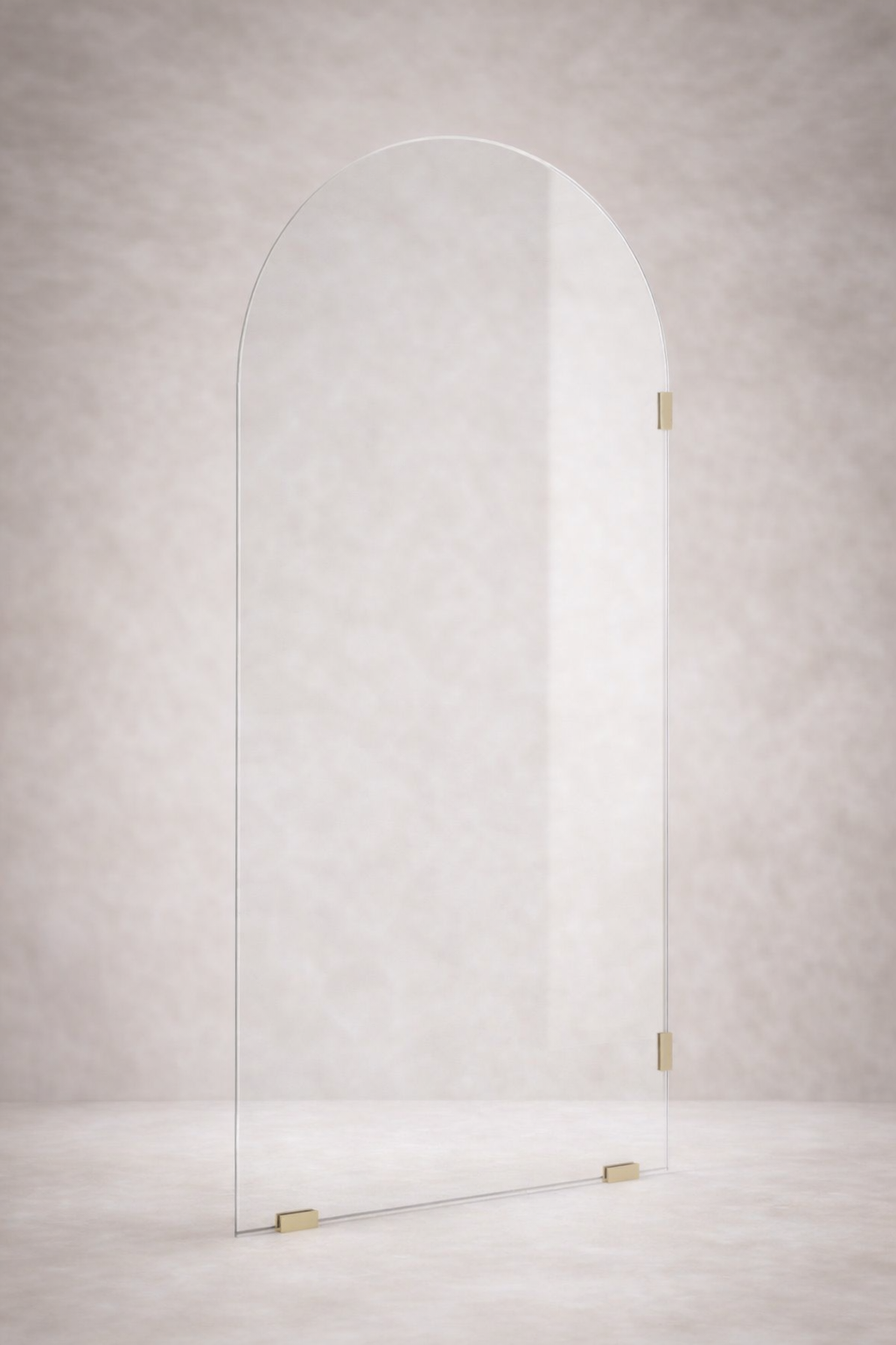 Arched glass door with brass fixtures on a light gray background